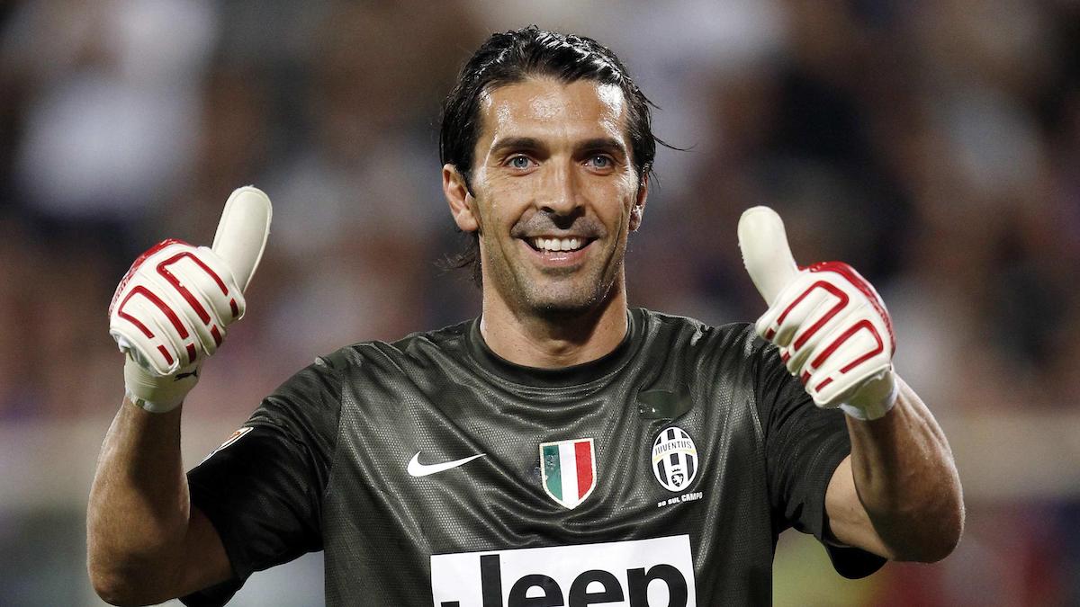 Juventus's goalkeeper Gianluigi Buffon gives a thumbs-up as he smiles during their Italian Serie A soccer match against Fiorentina at the Artemio Franchi stadium in Florence September 25, 2012. REUTERS/Giampiero Sposito (ITALY - Tags: SPORT SOCCER)